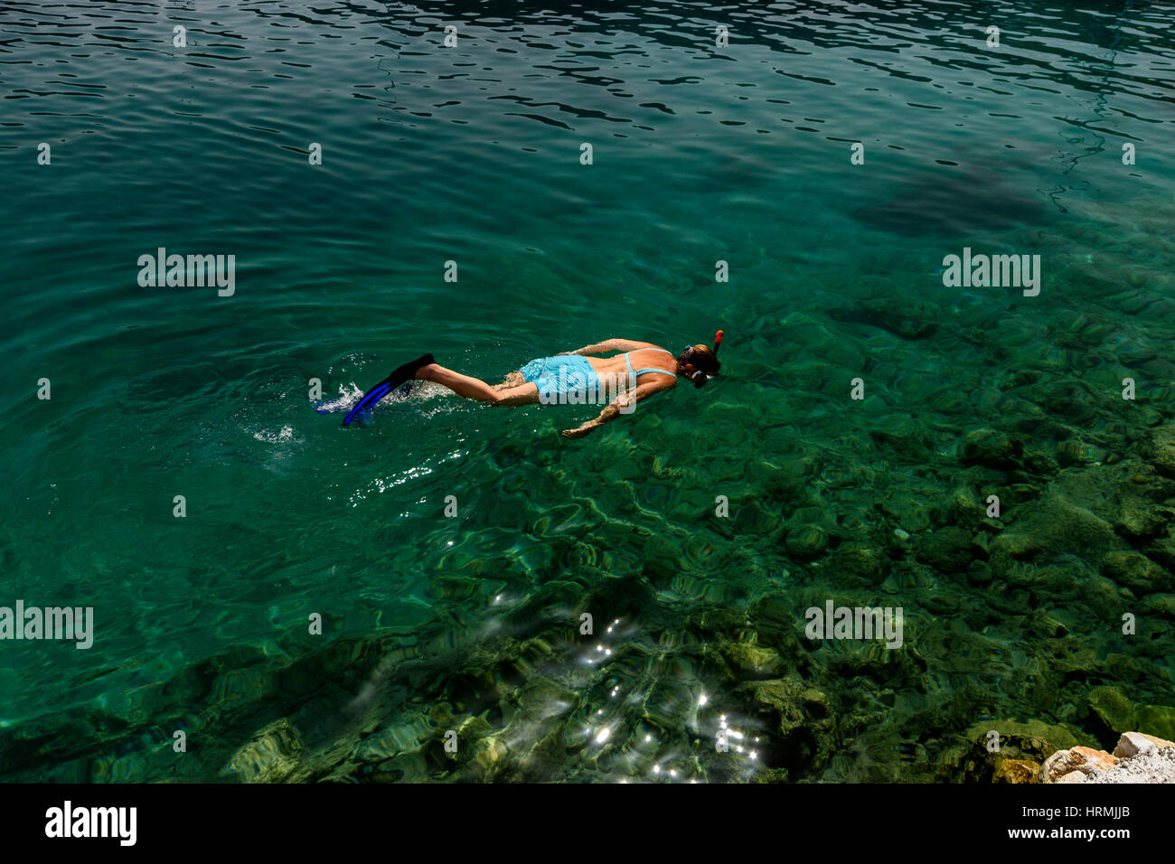 female snorkelling near Mongonissi Greece Stock Photo