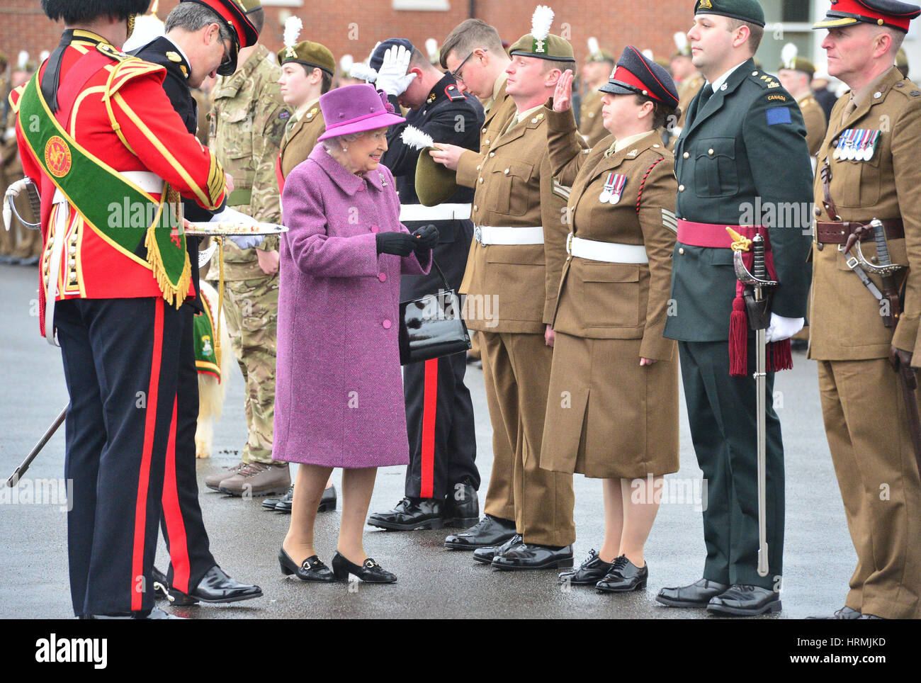 Queen Elizabeth II presents leeks to soldiers from The Royal Welsh Regiment, to mark St David's Day, at Lucknow Barracks in Tidworth, Wiltshire. Stock Photo