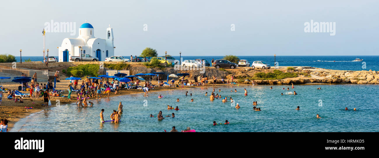 PARALIMNI, CYPRUS - 17 AUGUST 2014: Crowded beach with tourists Stock Photo