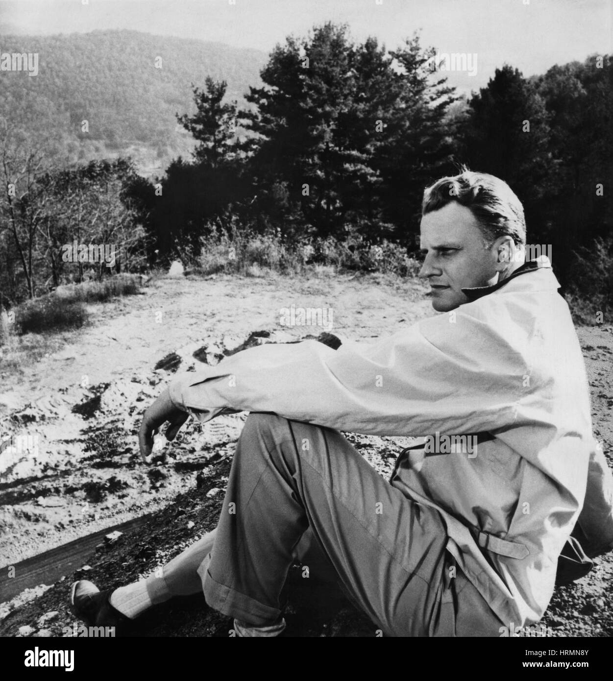 Evangelist Billy Graham relaxing at his mountainside home in Montreat, North Carolina a few days prior to his evangelistic crusade in New York City on May 15, 1957. Stock Photo