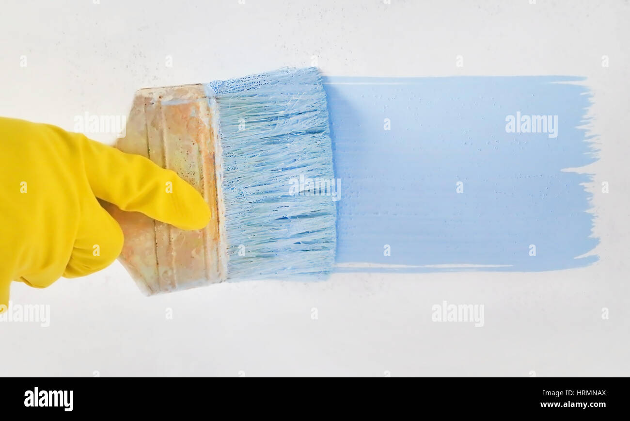 Painting wall with brush Stock Photo Alamy