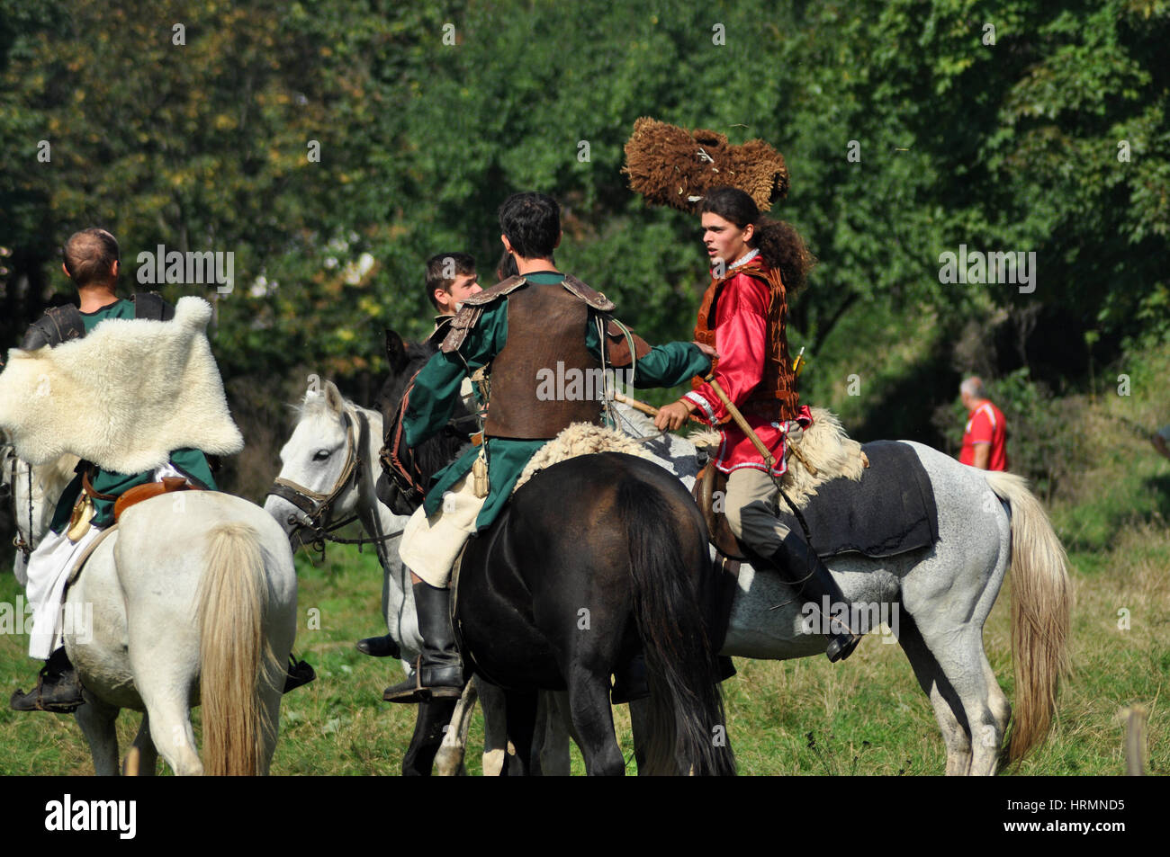 CLUJ-NAPOCA, ROMANIA - OCTOBER 3: Members of Eagles of Calata Nomadic group performing a free equestrian demonstration with Hunnic and archaic Hungari Stock Photo