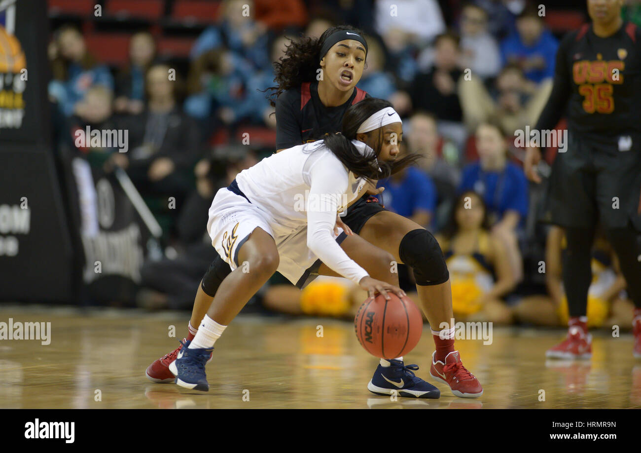 Seattle, WA, USA. 2nd Mar, 2017. Cal's Asha Thomas (1) protects the ball against USC's Minyon Moore (3) during a PAC12 women's tournament game between the Cal Bears and the USC Trojans. The game was played at Key Arena in Seattle, WA. Jeff Halstead/CSM/Alamy Live News Stock Photo