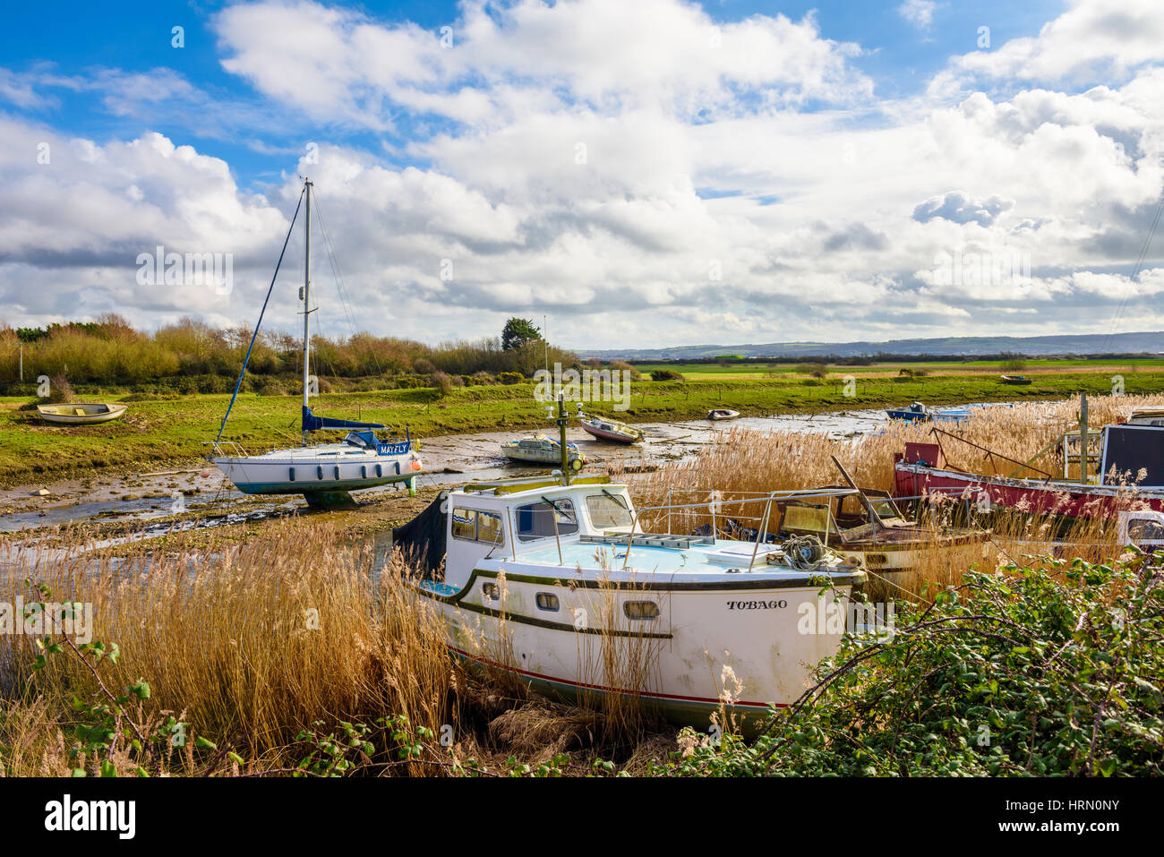 Boats on the River Caen at low tide. Braunton, Devon, England. Stock Photo