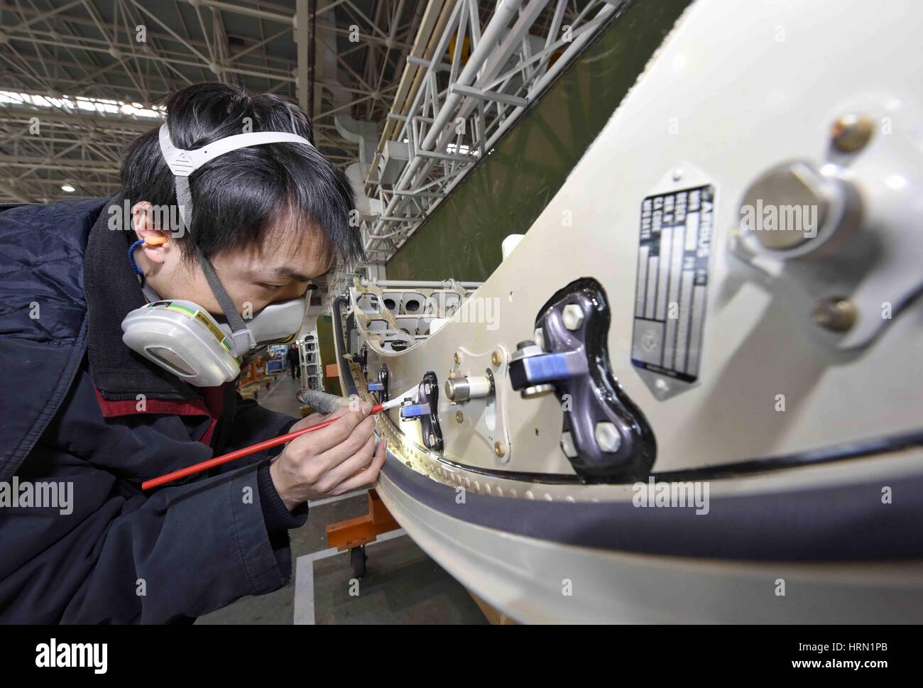 Chengdu, China's Sichuan Province. 3rd Mar, 2017. A man works at the ...