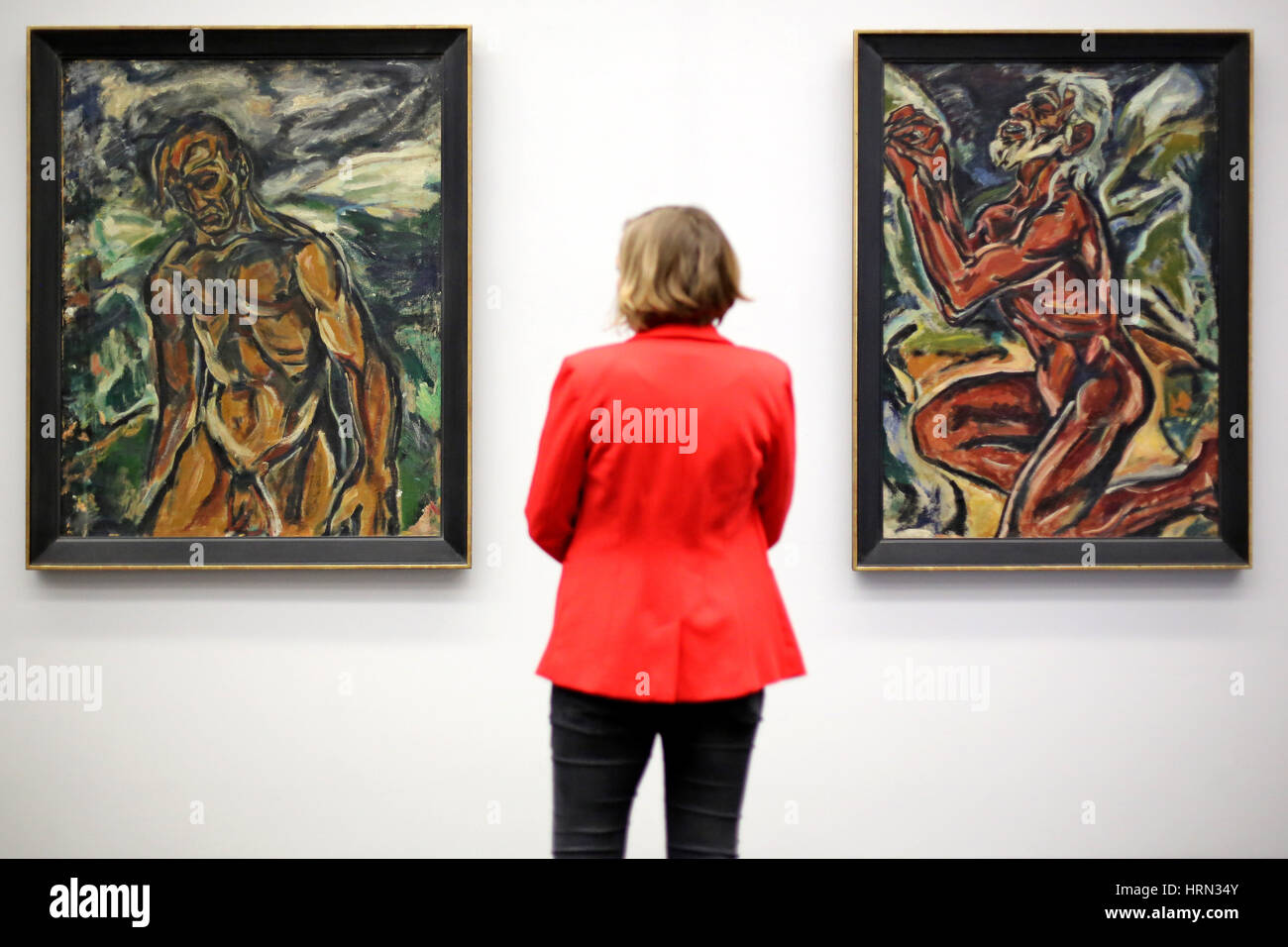 Chemnitz, Germany. 3rd Mar, 2017. A visitor looks at the painting 'Der Vereinsamte' (l) and 'Maennlicher Akt, knieend' (both 1914) by expressionist Fritz Ascher in Chemnitz, Germany, 3 March 2017. The Gunzenhauser museum presents paintings and graphics by expressionist Fritz Ascher (1893-1970) in a world premiere. About 40 works of the artist can be seen until 18 June. Photo: Jan Woitas/dpa-Zentralbild/dpa/Alamy Live News Stock Photo