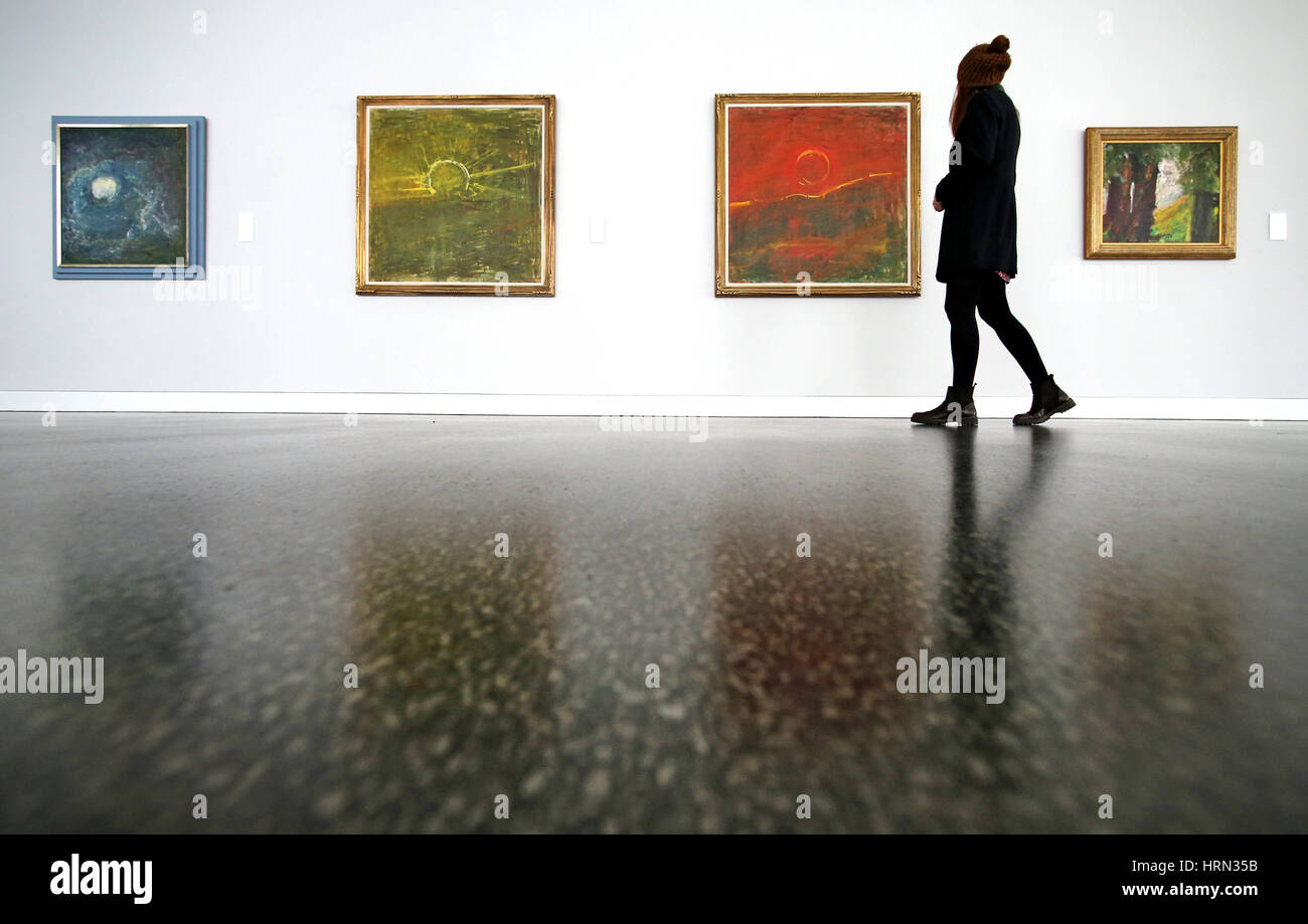 Chemnitz, Germany. 3rd Mar, 2017. A visitor looks at the painting 'Mond' (l-r), 'Sonnenuntergang', 'Untergehende Sonne' (all around 1960) and 'Baeume in huegeliger Landschaft' (1968) by expressionist Fritz Ascher in Chemnitz, Germany, 3 March 2017. The Gunzenhauser museum presents paintings and graphics by expressionist Fritz Ascher (1893-1970) in a world premiere. About 40 works of the artist can be seen until 18 June. Photo: Jan Woitas/dpa-Zentralbild/dpa/Alamy Live News Stock Photo