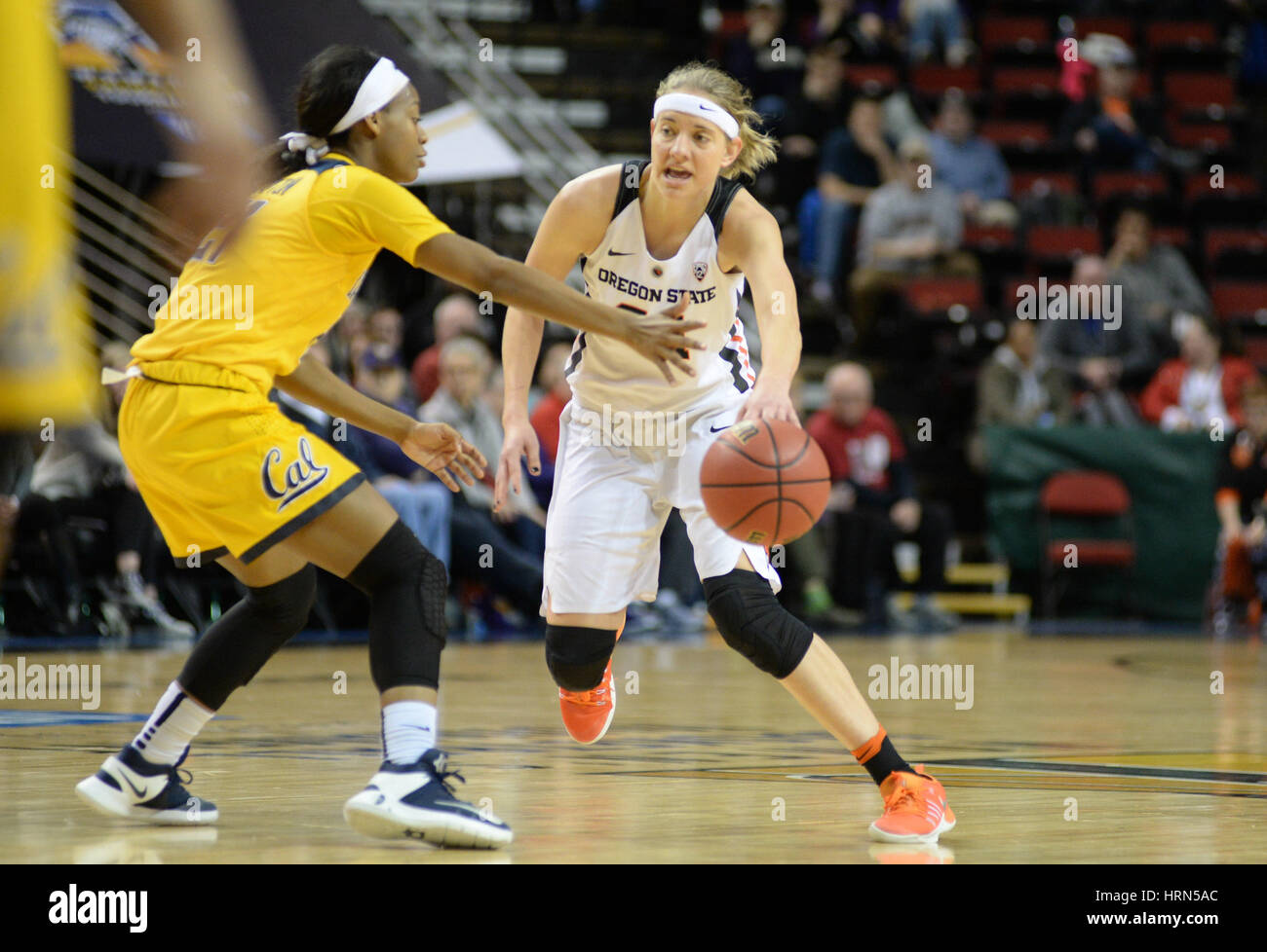 Seattle, WA, USA. 3rd Mar, 2017. OSU point guard Sydney Wiese (24) brings the ball down court against Cal's Mi'Cole Cayton (21) during a PAC12 women's tournament game between the Oregon State Beavers and the Cal Bears. The game was played at Key Arena in Seattle, WA. Jeff Halstead/CSM/Alamy Live News Stock Photo