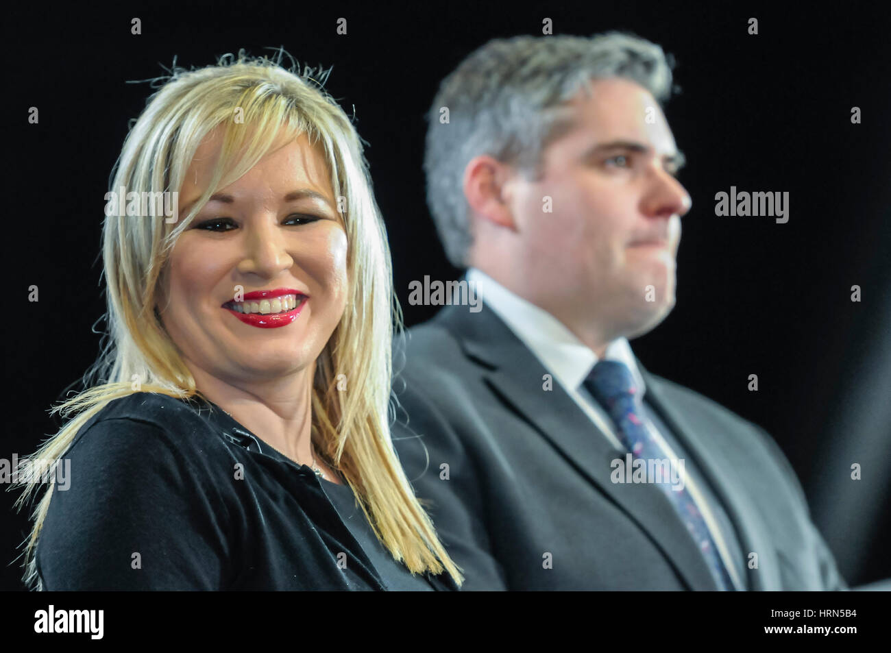 Belfast, Northern ireland. 03 Mar 2017 - Northern Ireland Assembly Election.  Michelle O'Neill (Sinn Fein) smiles as she sits beside the DUP's Gavin Robinson MP. Stock Photo