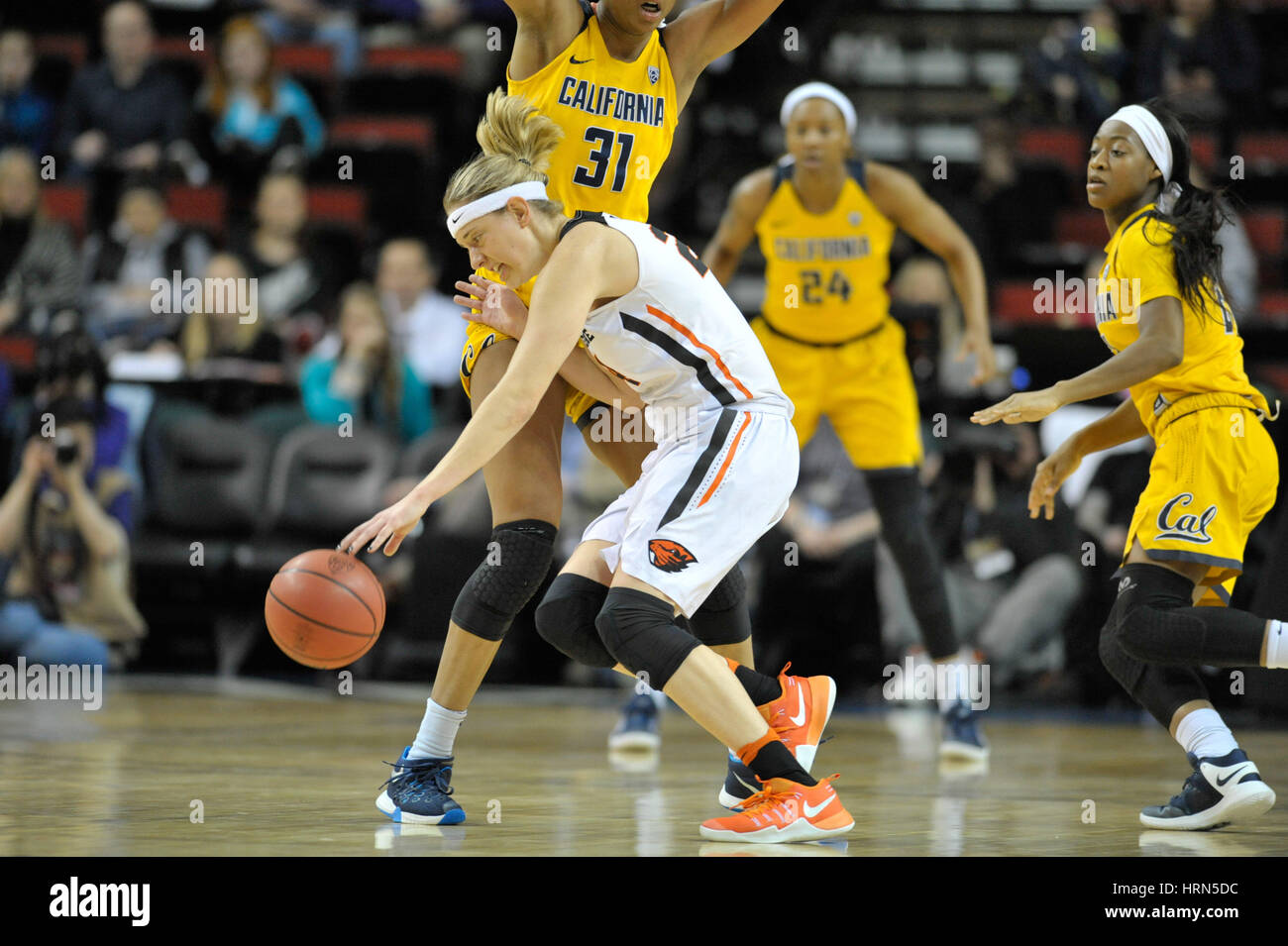 Seattle, WA, USA. 3rd Mar, 2017. OSU's point guard Sydney Wiese (24) is defended by Cal's Kristine Anigwe (31) during a PAC12 women's tournament game between the Oregon State Beavers and the Cal Bears. The game was played at Key Arena in Seattle, WA. Jeff Halstead/CSM/Alamy Live News Stock Photo