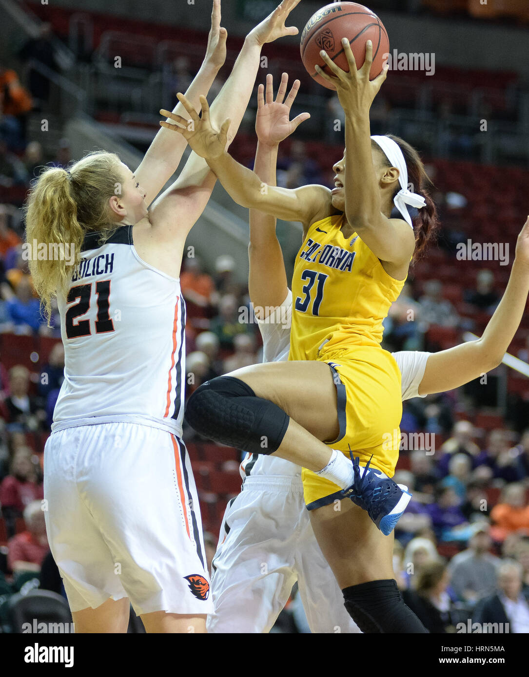 Seattle, WA, USA. 3rd Mar, 2017. Cal forward Kristine Anigwe (31) drives to the hoop against OSU center Marie Gulich (21) during a PAC12 women's tournament game between the Oregon State Beavers and the Cal Bears. OSU won the game 65-49. The game was played at Key Arena in Seattle, WA. Jeff Halstead/CSM/Alamy Live News Stock Photo