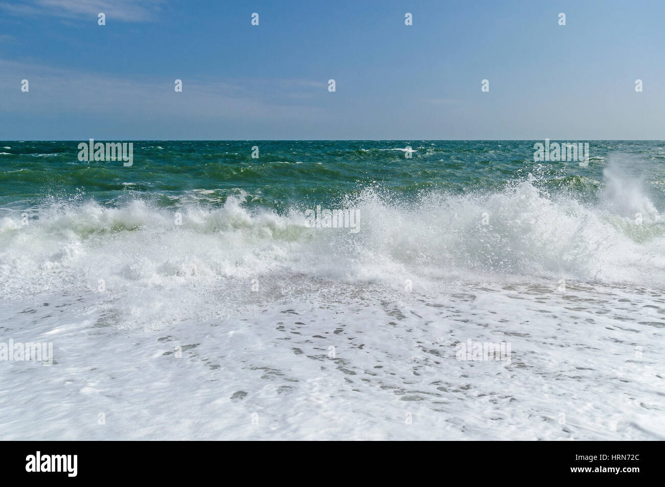 crashing waves on beach Stock Photo