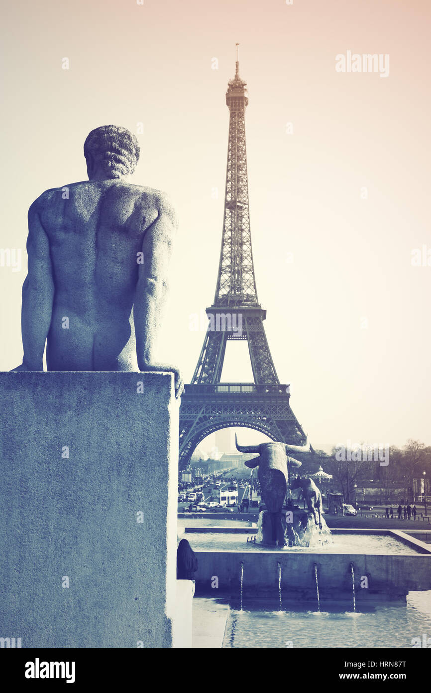 Sculptures on Trocadero and Eiffel Tower in Paris, France. Retro style filtered image Stock Photo