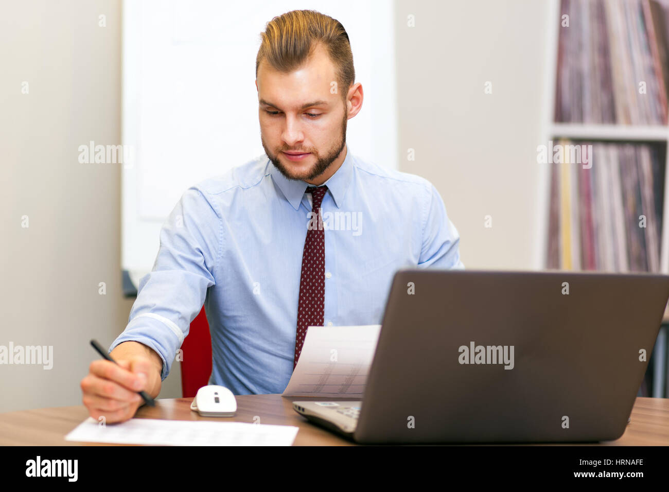 Handsome businessman at his desk in the office Stock Photo Alamy