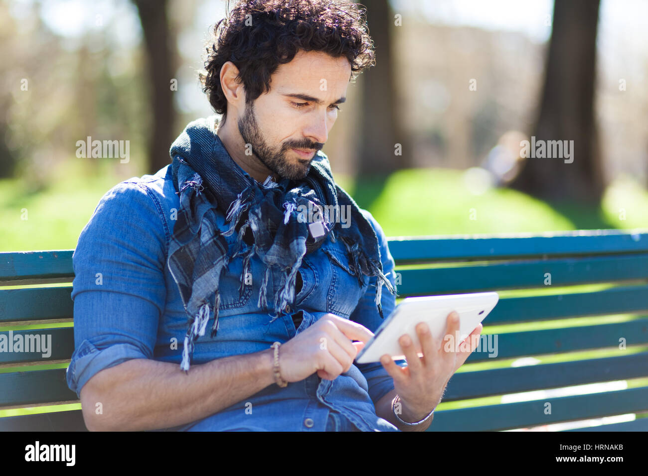 Portrait of a man using a tablet Stock Photo - Alamy