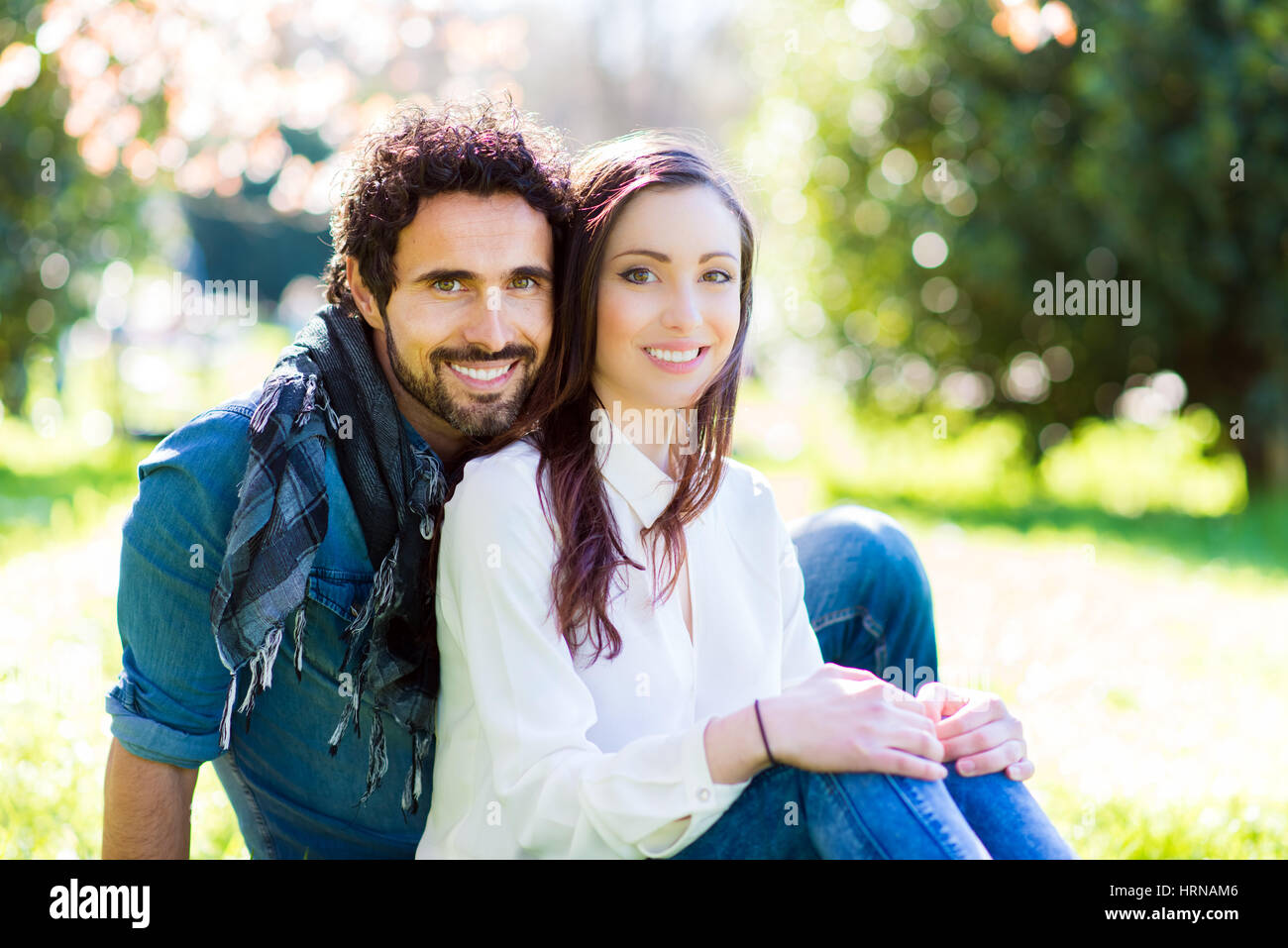 Couple relaxing outdoors Stock Photo - Alamy