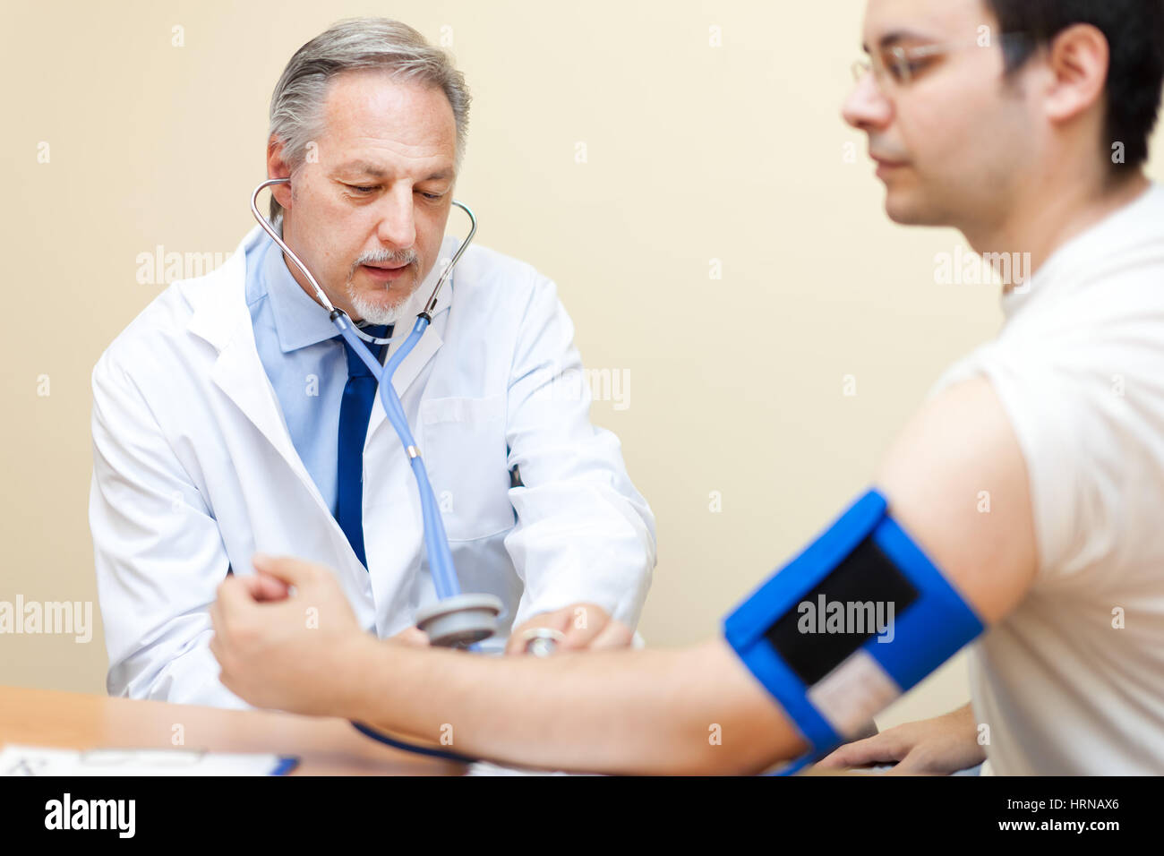 Doctor Checking Blood Pressure Stock Photo Alamy