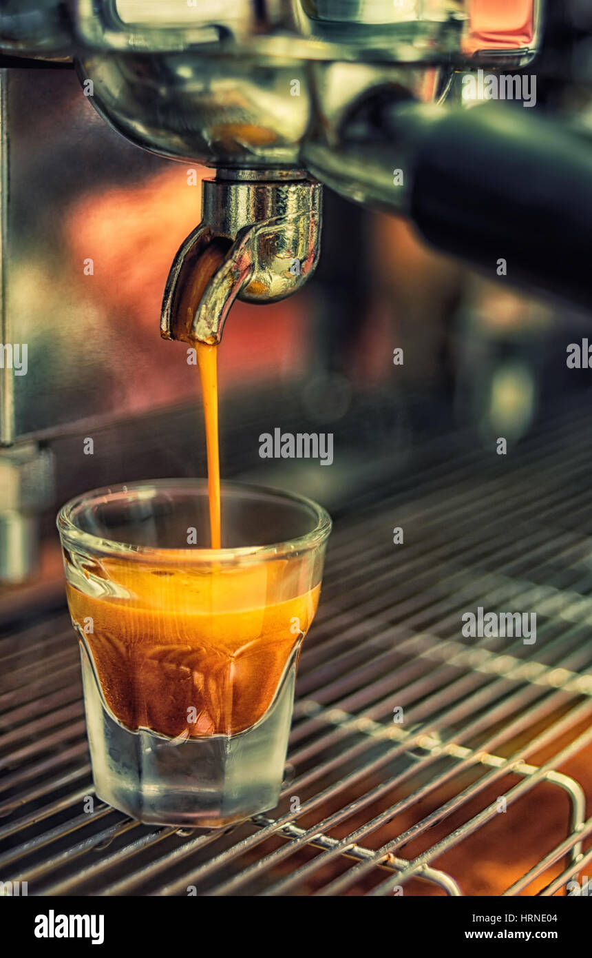 https://c8.alamy.com/comp/HRNE04/espresso-pouring-from-coffee-prepares-machine-soft-focus-close-up-HRNE04.jpg