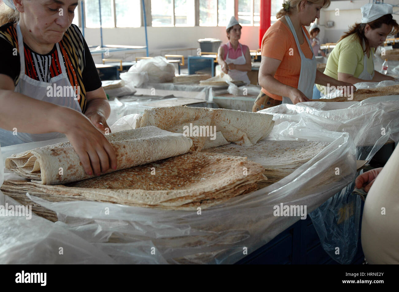 YEREVAN, ARMENIA - JULY 16, 2006: Unidentified sales persons selling ...