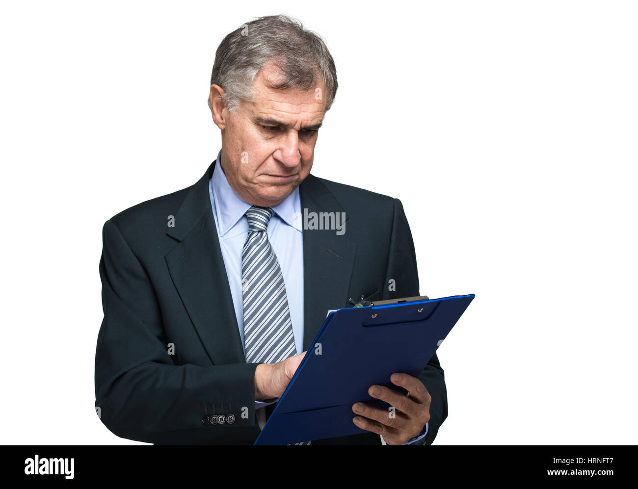 Handsome businessman writing on a clipboard Stock Photo - Alamy