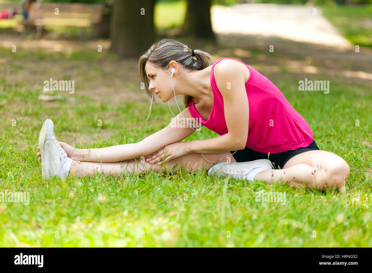 Woman stretching her legs Stock Photo - Alamy