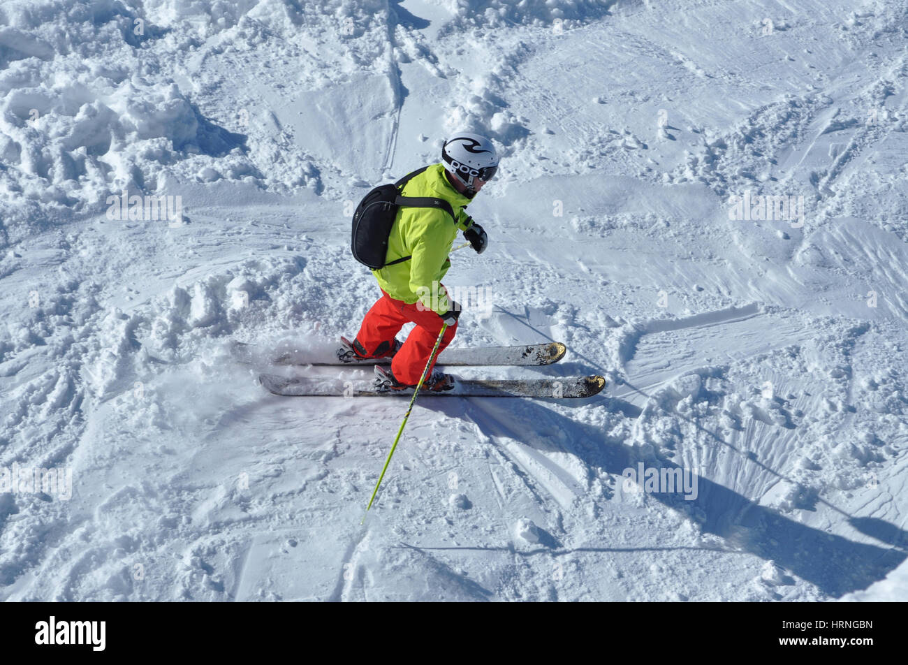 KAPRUN, AUSTRIA - MARCH 3, 2012: Skiers enjoying one of the last ski days of the season, skiing in the Austrian Alps Stock Photo