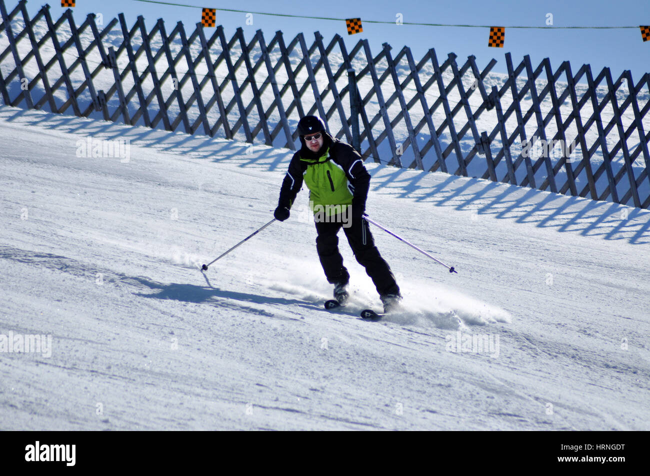 KAPRUN, AUSTRIA - MARCH 3, 2012: Skiers enjoying one of the last ski days of the season, skiing in the Austrian Alps Stock Photo