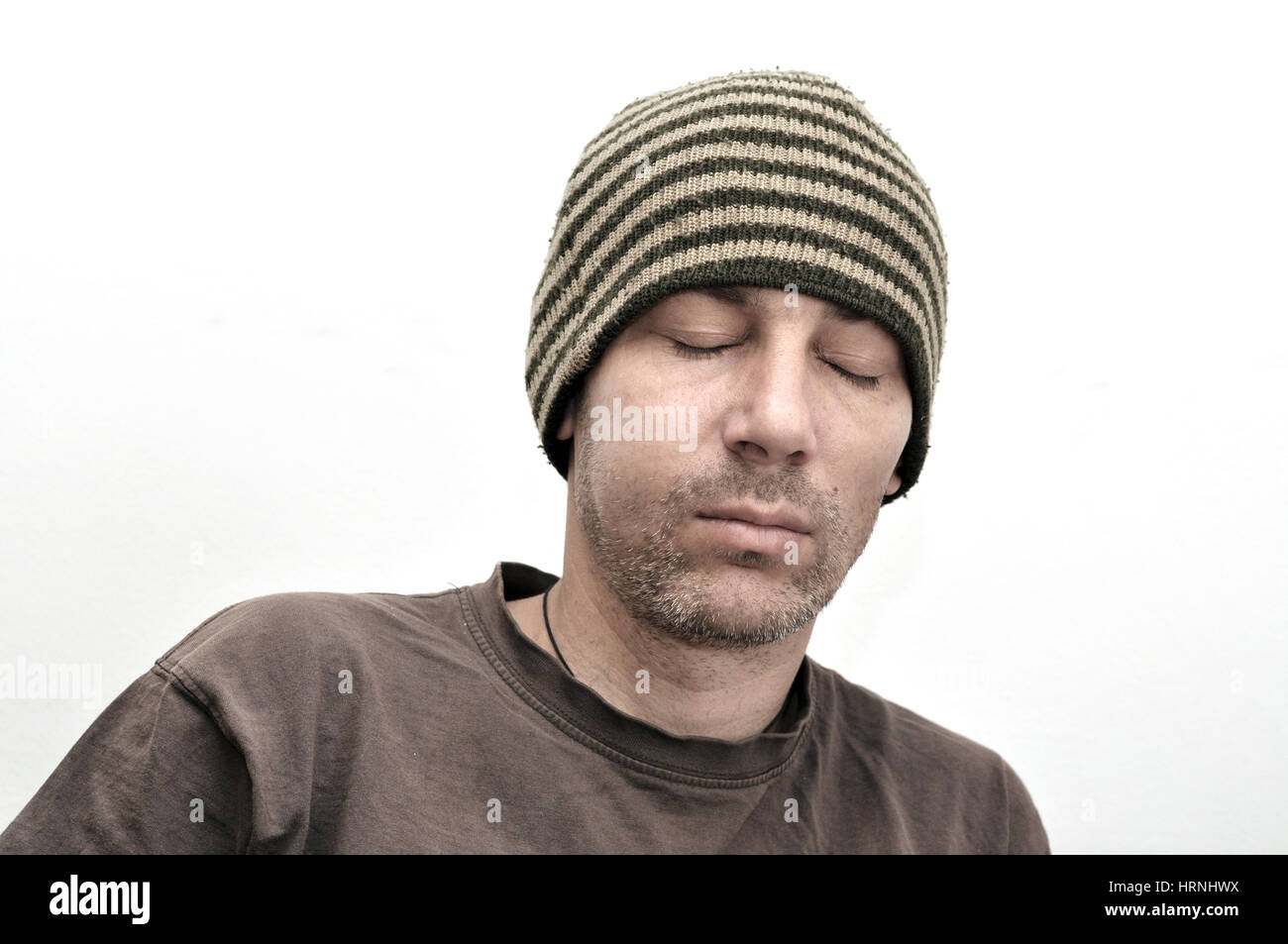 Young man suffering from toothache, teeth pain, swollen face Stock