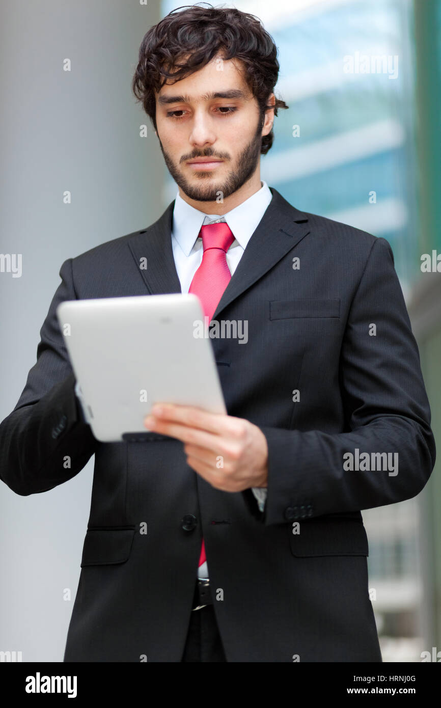 Man using a tablet Stock Photo - Alamy