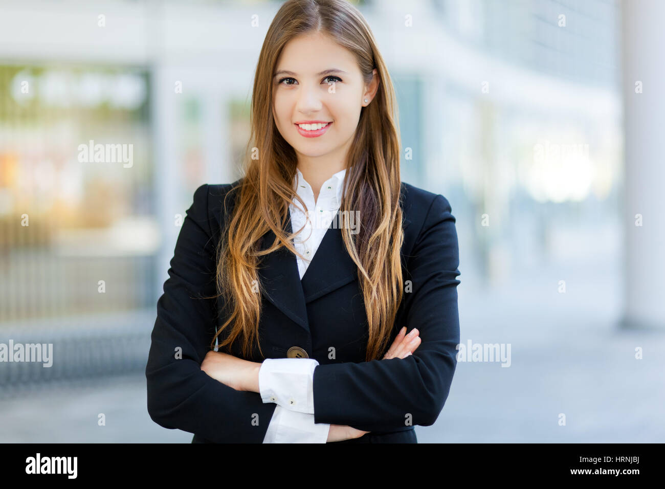 Portrait of a young smiling business woman outdoor Stock Photo - Alamy