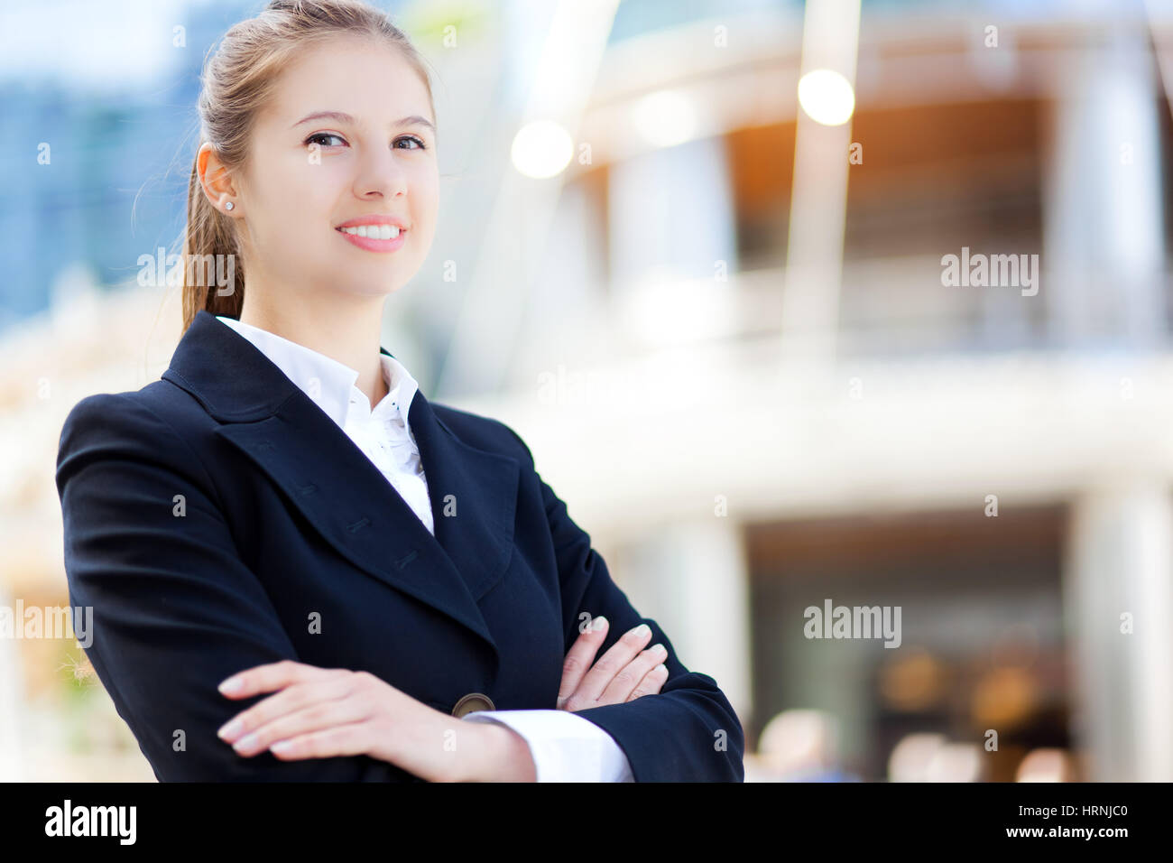 Portrait of a young smiling business woman outdoor Stock Photo - Alamy