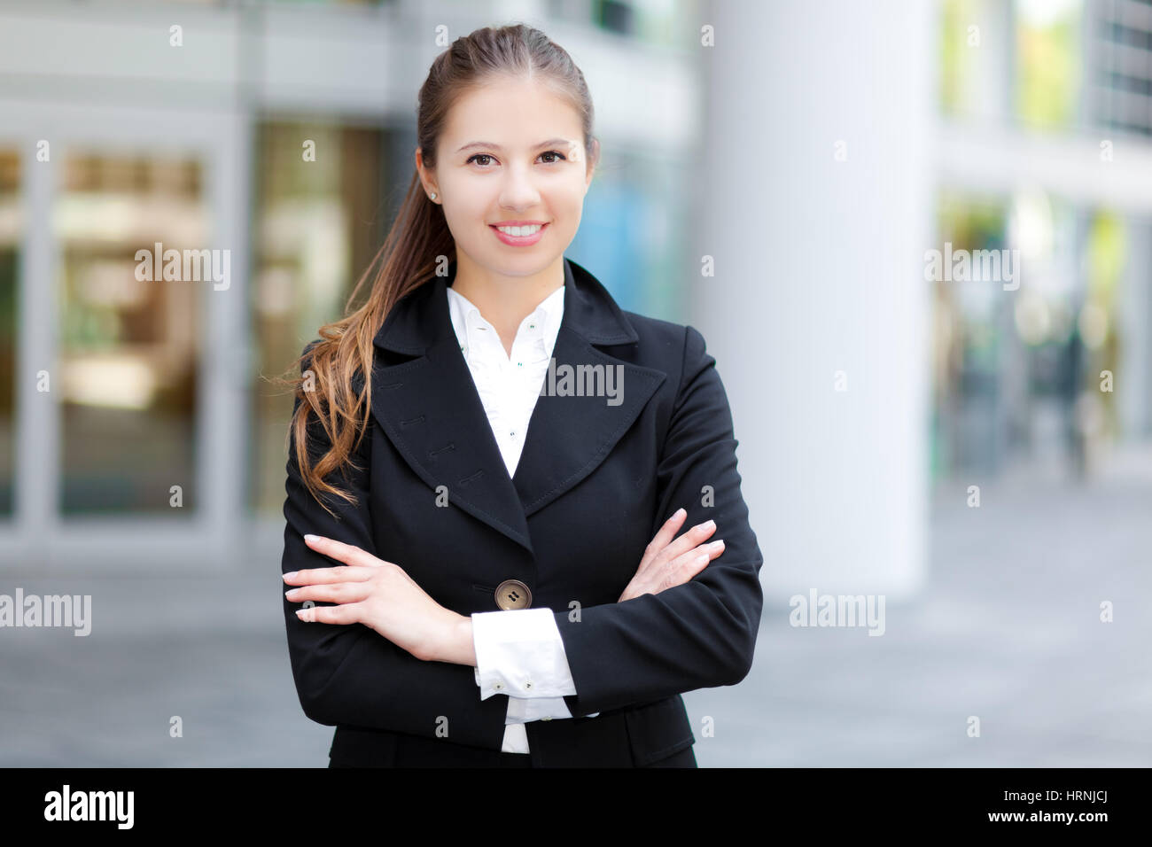 Portrait of a young smiling business woman outdoor Stock Photo - Alamy