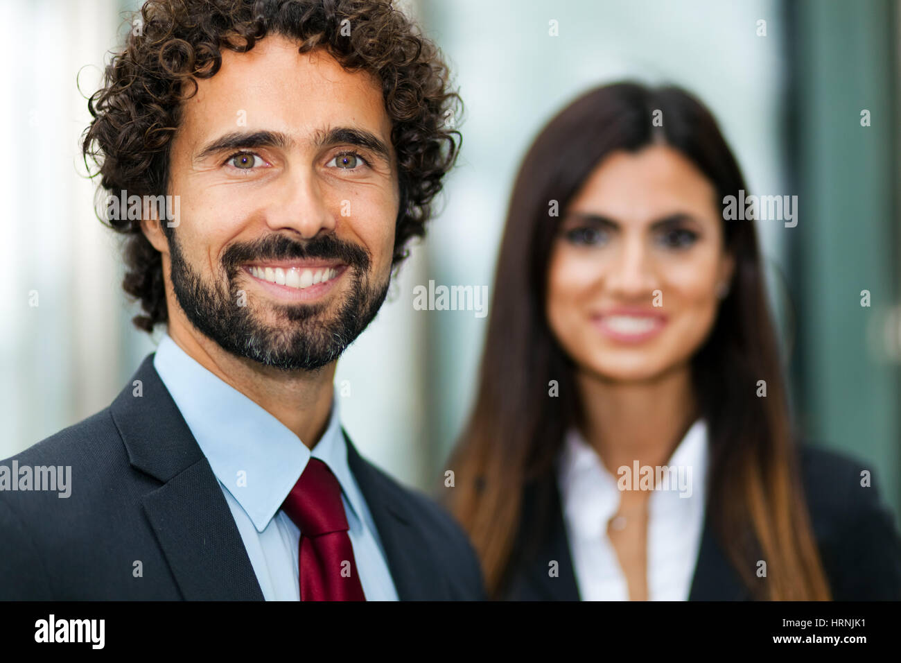 Portrait of smiling business people Stock Photo - Alamy