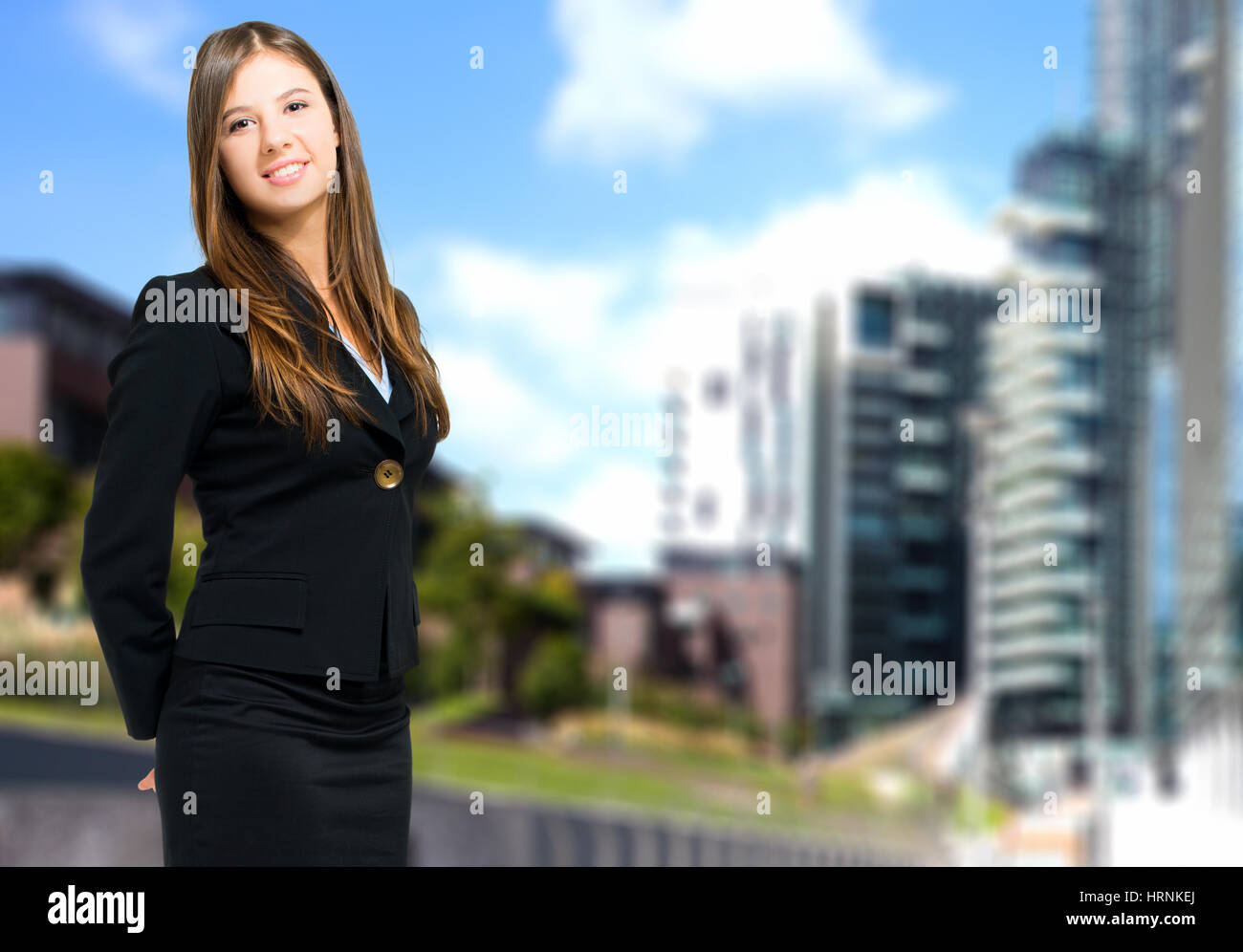 Portrait of a young smiling business woman Stock Photo - Alamy