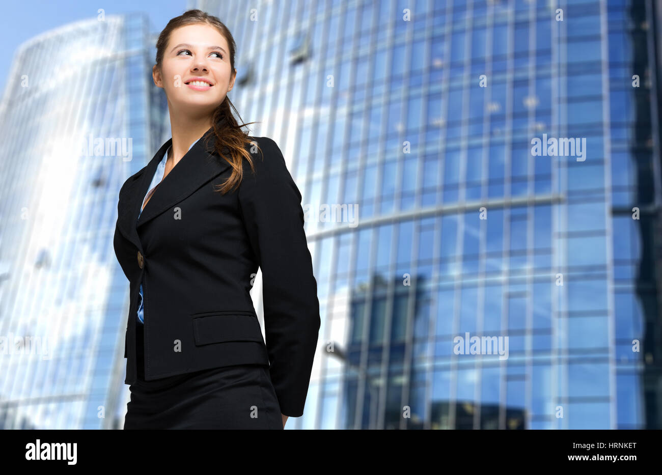 Portrait of a young smiling business woman Stock Photo - Alamy