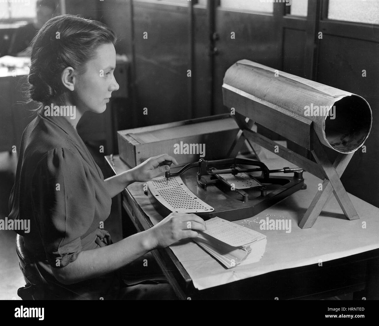 Woman Operating Hollerith Card Puncher Stock Photo