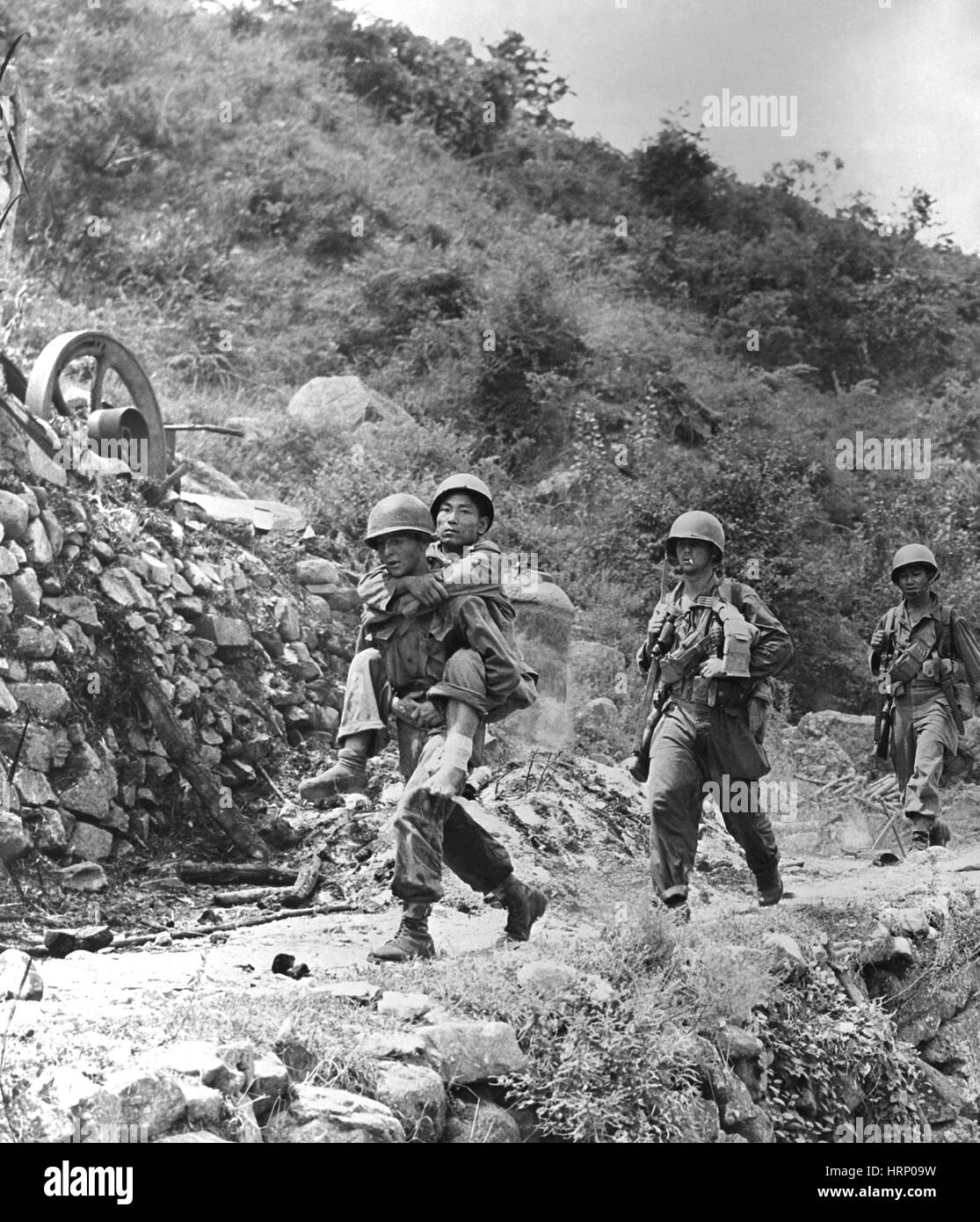 Korean War, U.S. Soldier Carries Wounded ROK Stock Photo