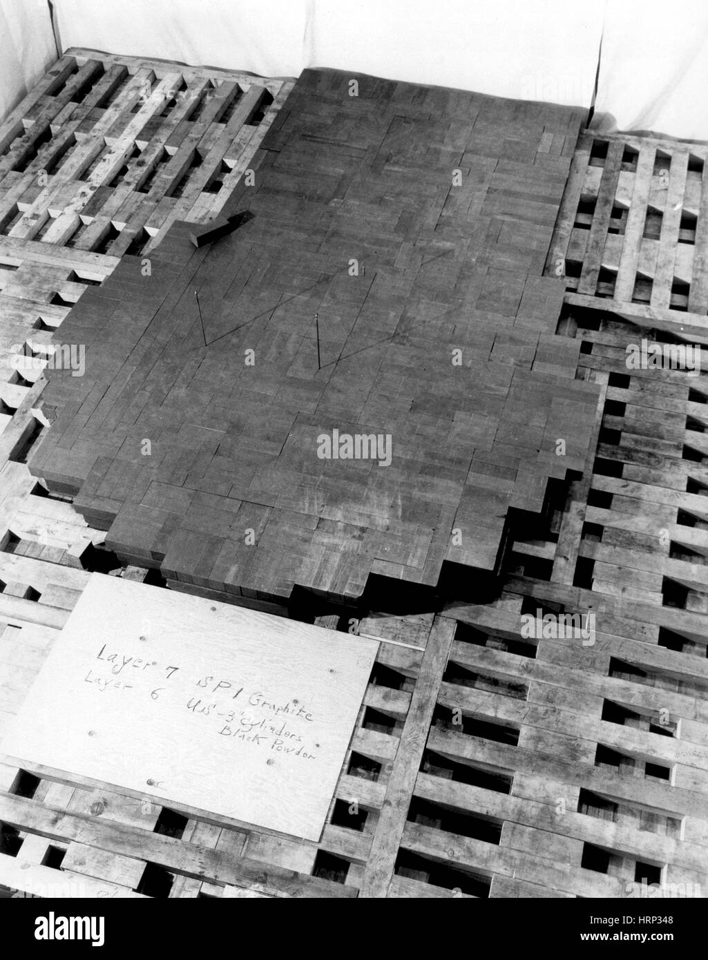 CP-1 during assembly. Photograph shows the 7th layer of graphite blocks and edges of the 6th layer. Chicago Pile-1 (CP-1) was the world's first artificial nuclear reactor. The construction of CP-1 was part of the Manhattan Project, and was carried out by the Metallurgical Laboratory at the University of Chicago. Stock Photo