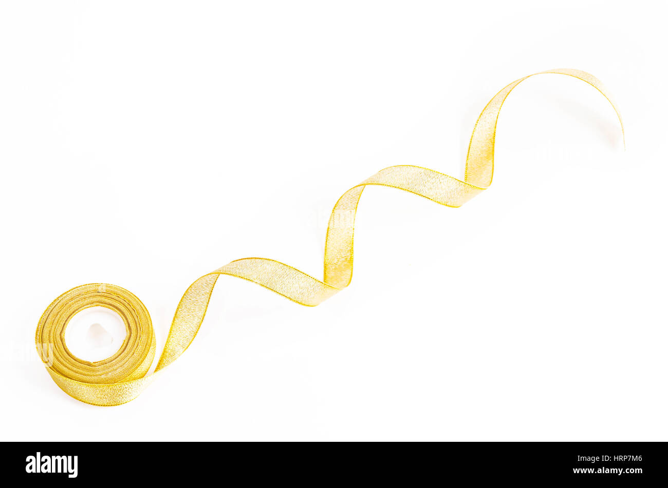 gold ribbon roll on white background Stock Photo Alamy