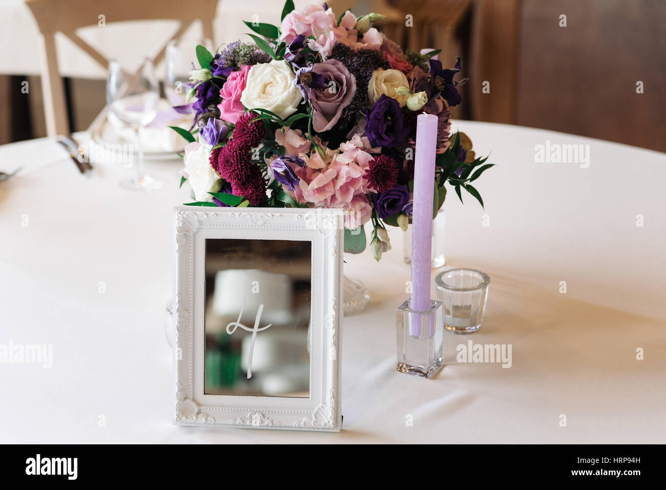 Wedding table with candles, flowers and sign number Stock Photo Alamy