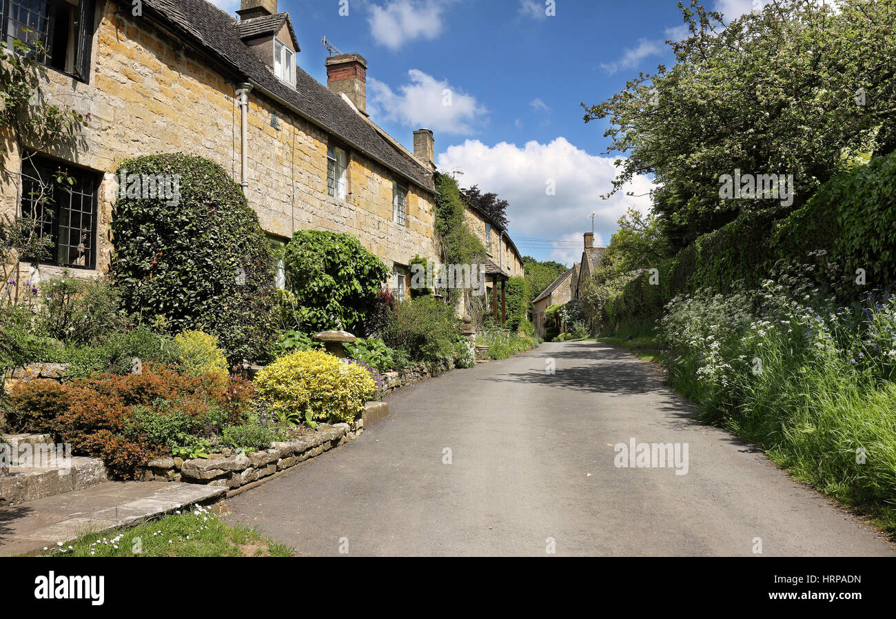 A Row of Terraced Cottages in a traditional Cotswold Village street Stock Photo