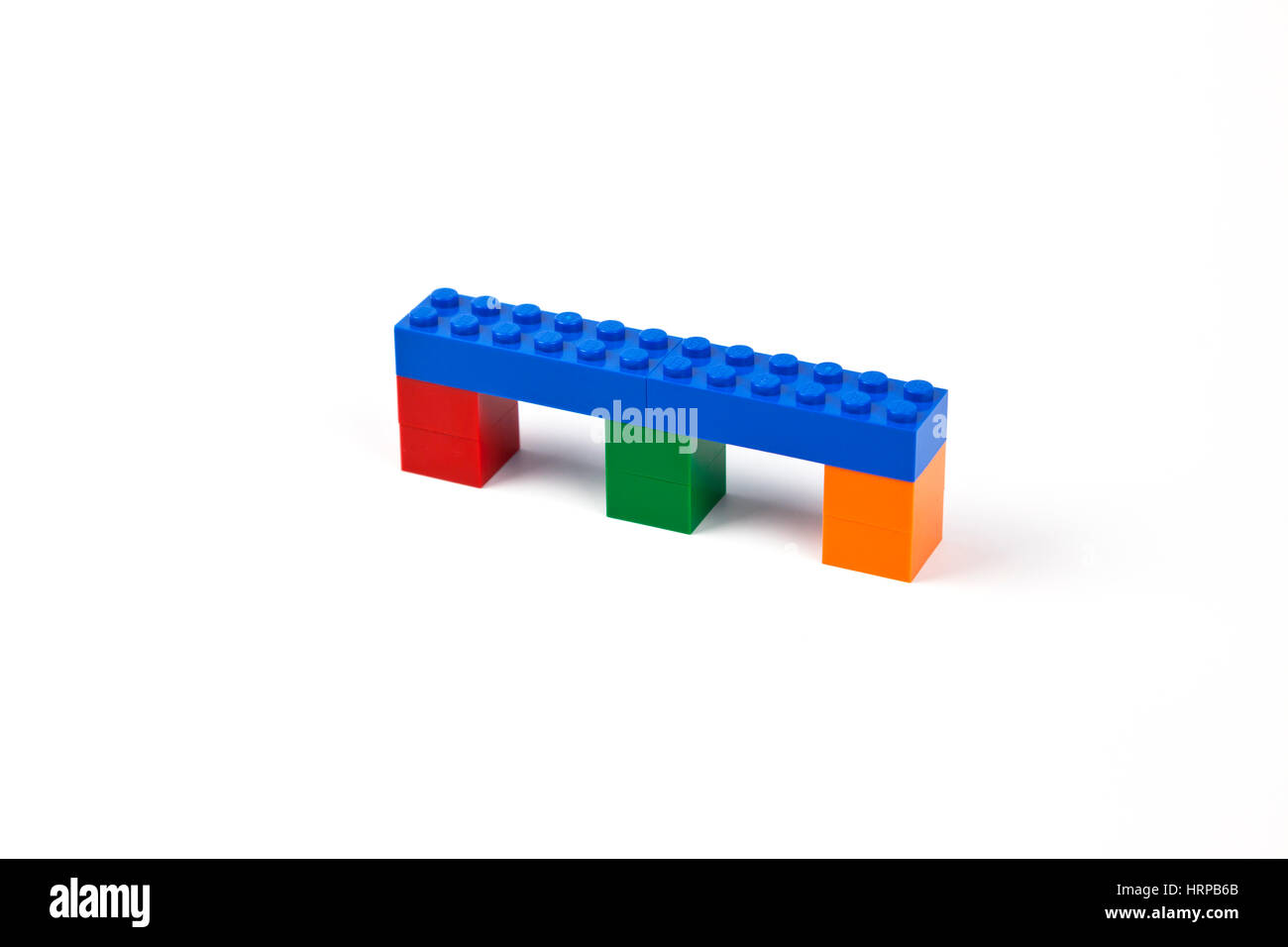Blue bridge or viaduct model of Lego bricks or pieces resting on three piers. Stock Photo