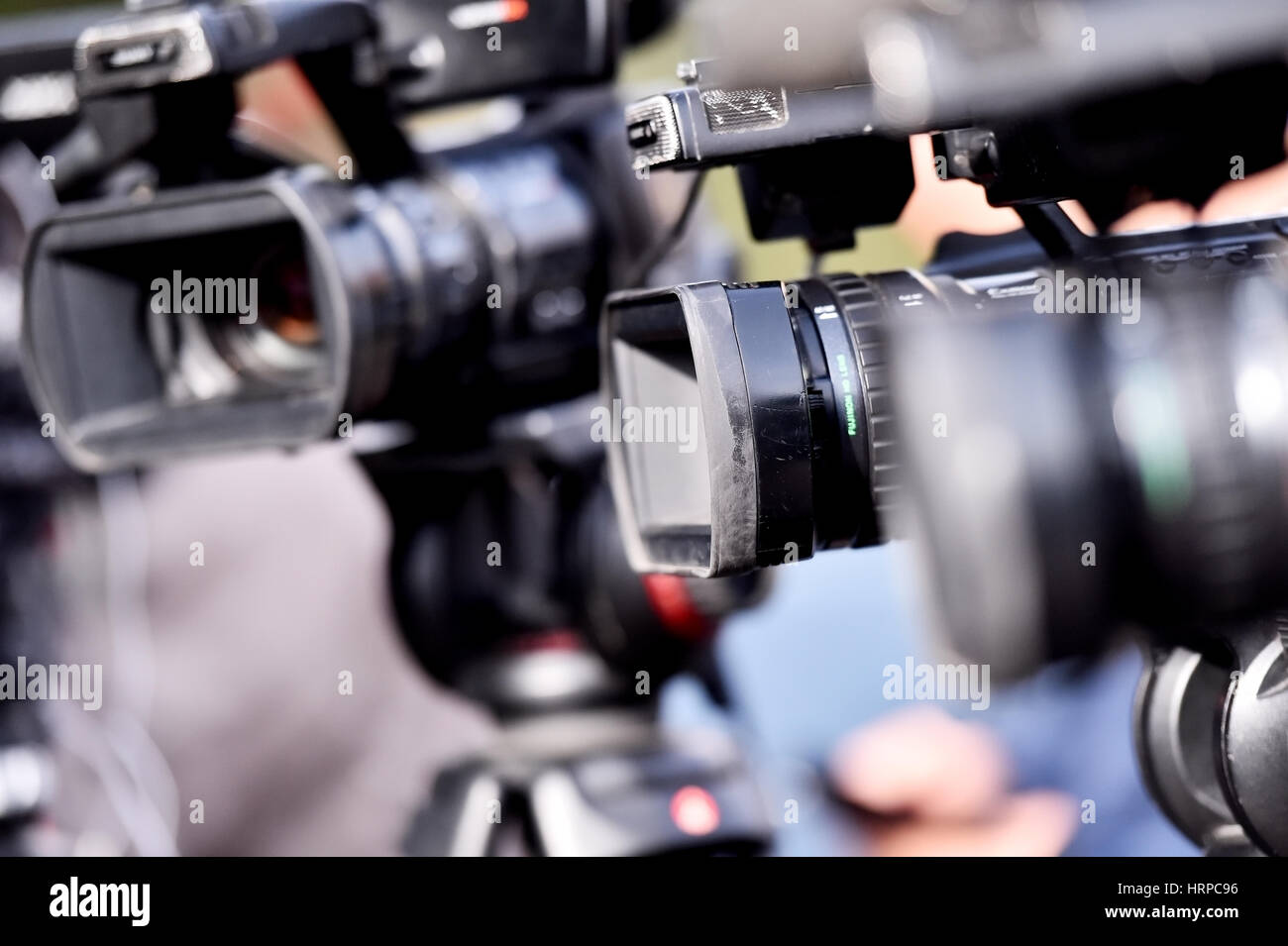 Lots of television cameras in a row broadcasting a live media event Stock Photo