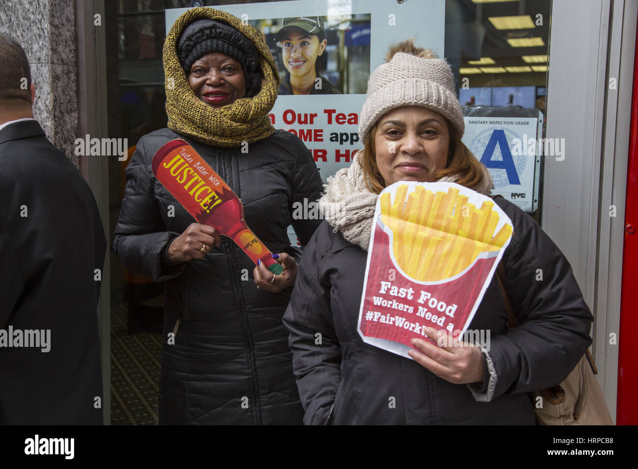 Fast food workers hold a rally and press conference in front of a ...