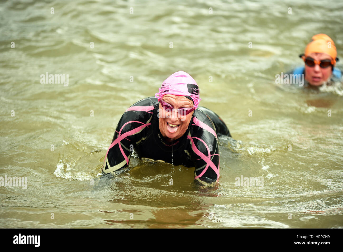 Swimmers finish the Ullswater Swim, Lake District UK Stock Photo