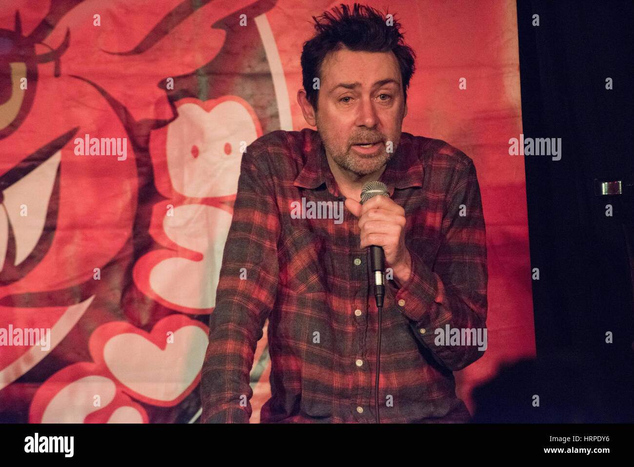 Comedian and writer Sean Hughes at The Red Imp Comedy Club @ The Rose and Crown Pub Walthamstow, London E17.   Red Imp is an independent comedy club founded and hosted by comedian Susan Murray it attracts a wealth of A list comedy talent many of whom use the venue as an opportunity to test out new material. Stock Photo