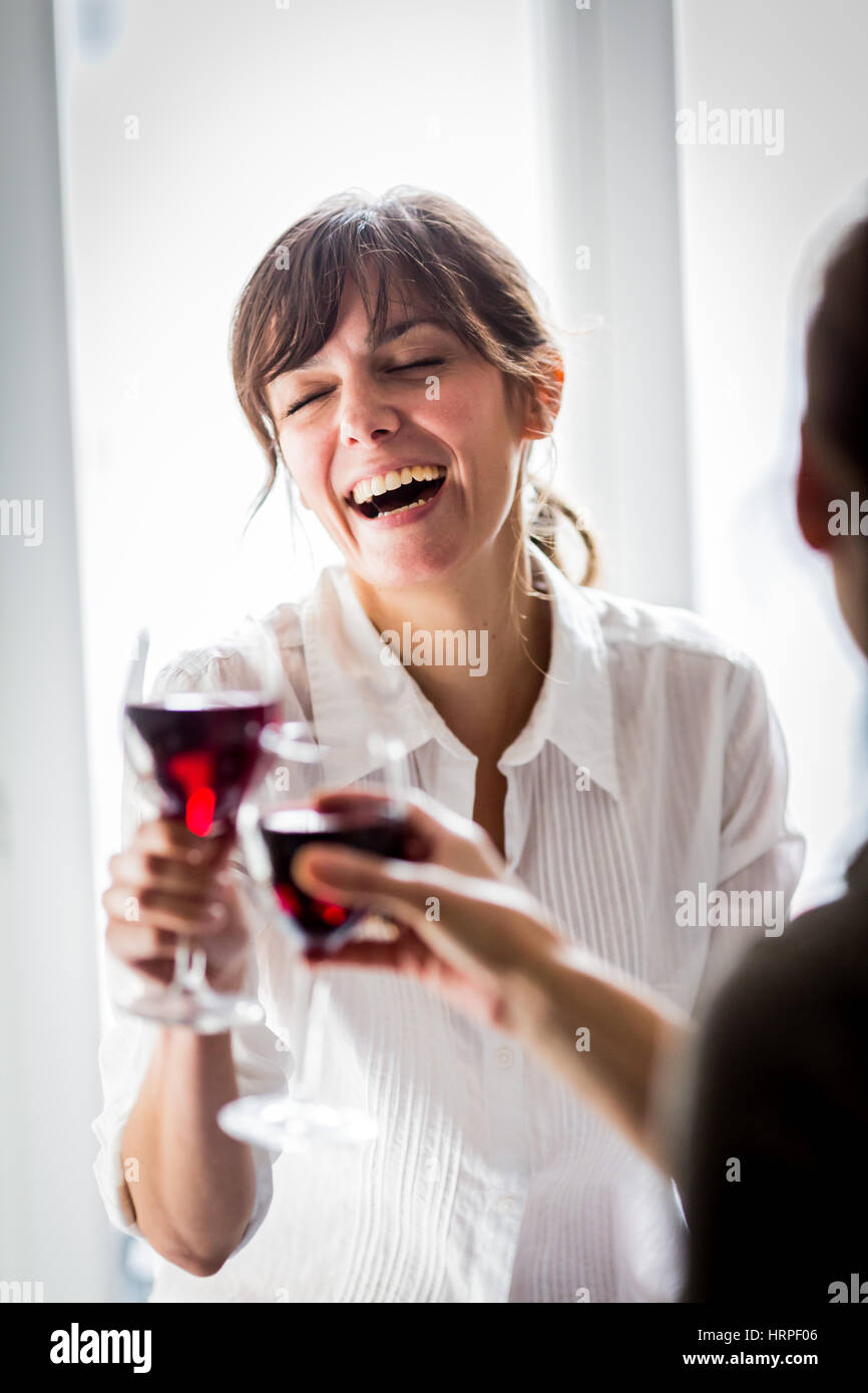 Woman drinking a glass of red wine Stock Photo - Alamy
