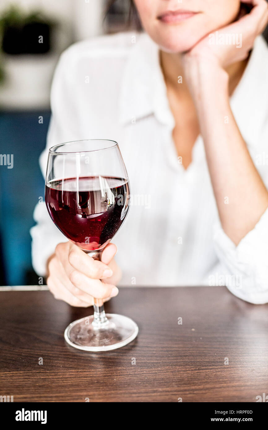 Woman drinking a glass of red wine Stock Photo - Alamy
