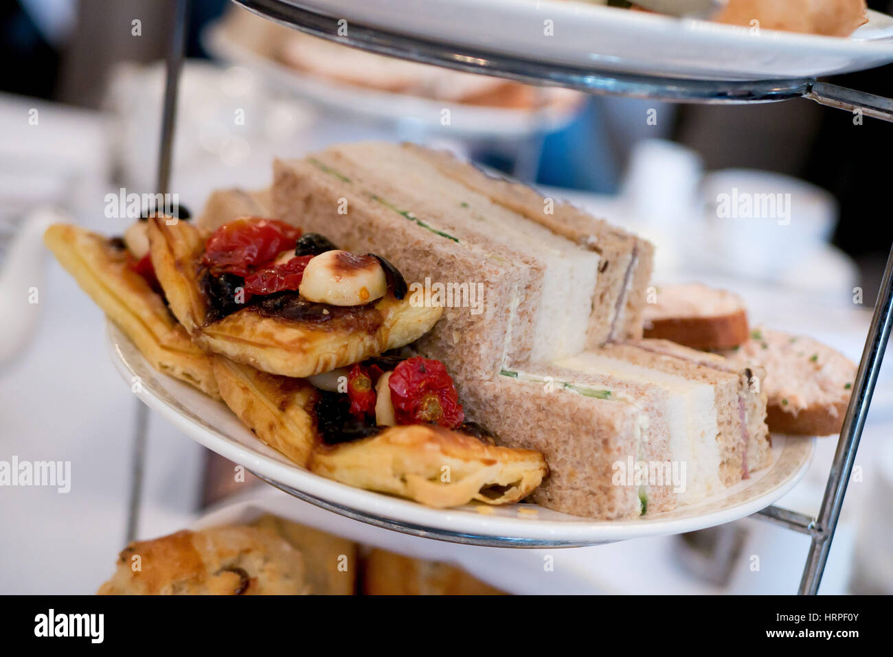 Finger sandwiches and pastries at a cream tea. Stock Photo