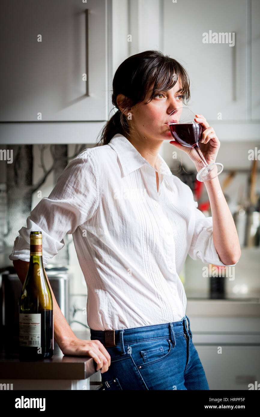 Woman drinking a glass of red wine Stock Photo - Alamy